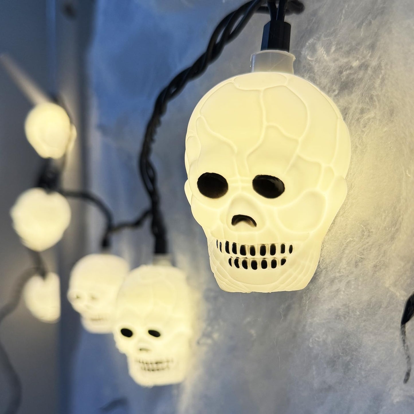 Kivonfa Halloween Ghost String Lights, 8.5Ft with 10 LED White Skeletons, Black Wire, Model LR-LED-L-10E/1F-D45