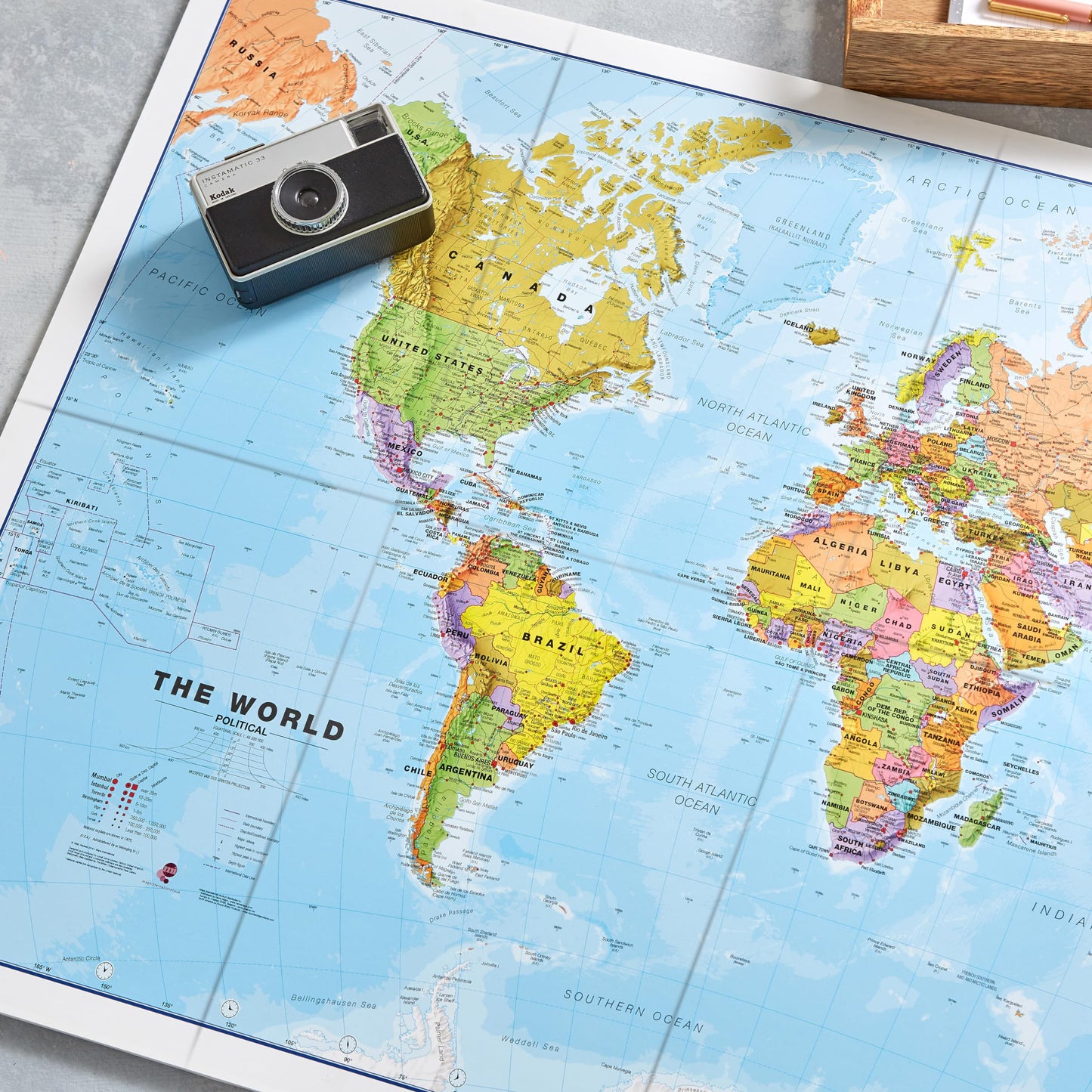 Maps International - World Map - Updated 2026 - Silk Art Paper - Folded Format - 23 (h) x 33 (w)"
