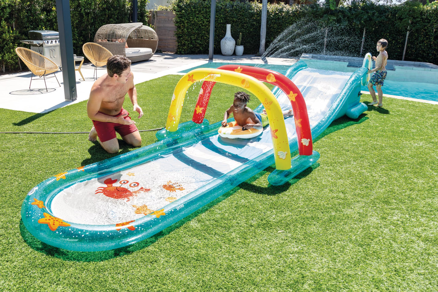 INTEX Inflatable Surfing Fun Slide: Includes Two Inflatable Surf Riders – Built-in Water Sprayer – 221" x 54" x 39" – Ages 6+